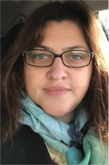 Rachel S. Harris Headshot with glasses and scarf